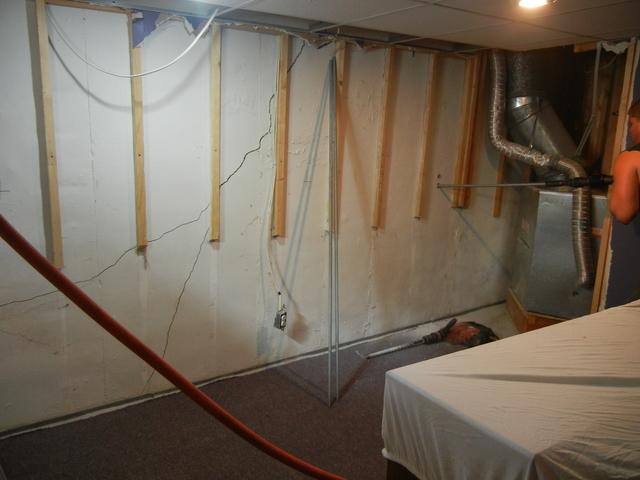 <p>You can see the stress cracking in the wall where <a href="https://www.suredrybasements.com/foundation-repair-wisconsin/foundation-repair-products/wall-anchors.html">anchors</a> will be installed. &nbsp;This will stabilize the wall from bowing in any further.</p>