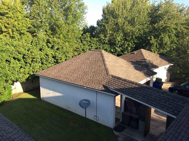 The average house's roof can take up to 50% of the entire house's appearance. The difference a new roof can make on your home's curb appeal is pretty surprising. Compare this picture with the second and third pictures in this album. What a difference!