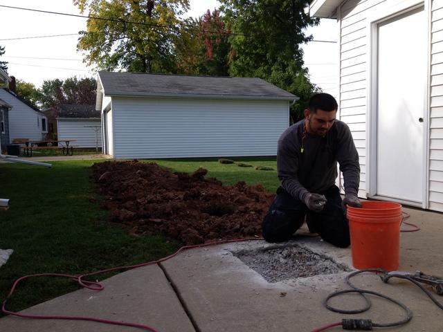 <p>Clearing stone out of the way to install an <a href="https://www.suredrybasements.com/foundation-repair-wisconsin/foundation-repair-products/wall-anchors.html">anchor</a>&nbsp;plate.</p>