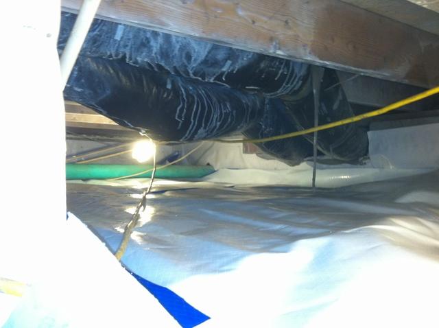 Installing Vapor Barrier in Fuquay Crawlspace