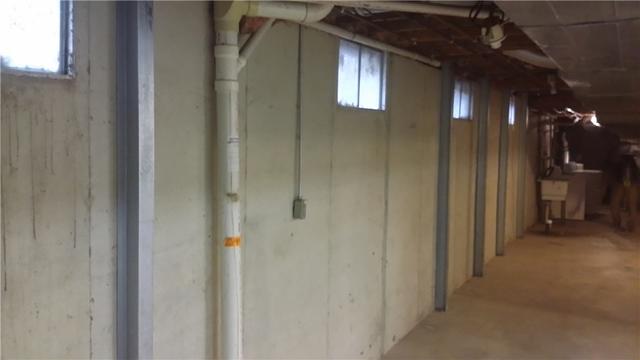 We installed multiple PowerBraces along this bowing wall to stabilize it and prevent further leaning.