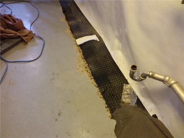 Once the drain tile and waterproofing have been installed we cover our work with new concrete.