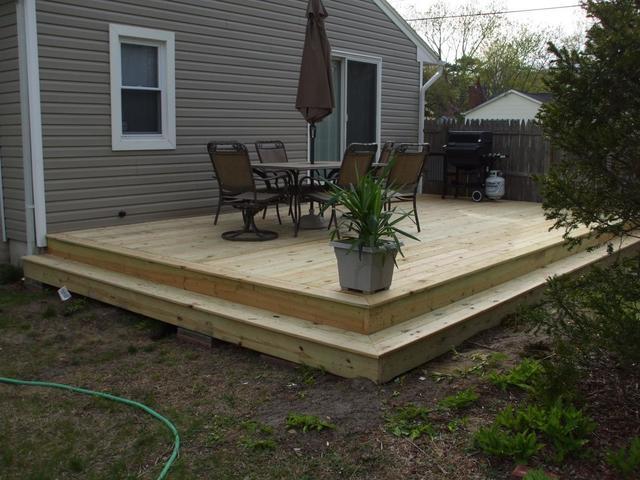 Wooden Deck Installed in Back Yard