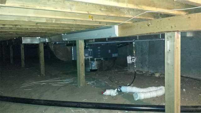 Dirt floors cannot be relied on as a space to use for storing items. This crawl space is quite roomy and would be a great spot for some holiday decorations if it were encapsulated properly.