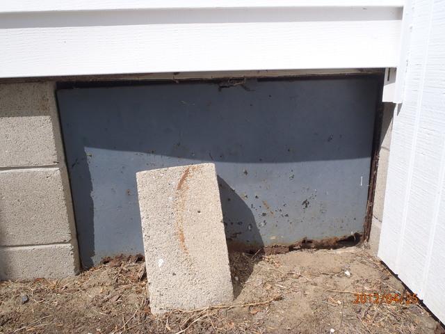 Rusted Crawlspace Door