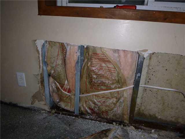 The problem with finished basements that aren't waterproofed is that you might not know what's happening behind those finishes. Look at the walls around the cut away part - not much gives away the state of the block walls. But the insulation is mold ridden.