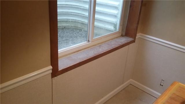 The area around the egress windows was the most affected by water, so we cut away those portions of the walls and replaced them with waterproof, inorganic wall panels.