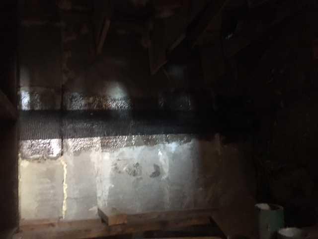 Carbon Armor Straps Against Foundation Wall