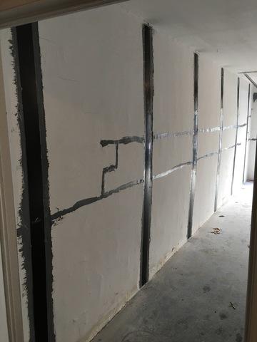 Here you can see we had to remove the sealcoat that was on the foundation wall in order to install our reinforcers effectivly.