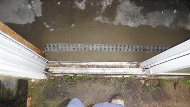 Trench Drain Collects Water Coming In From Doorwall