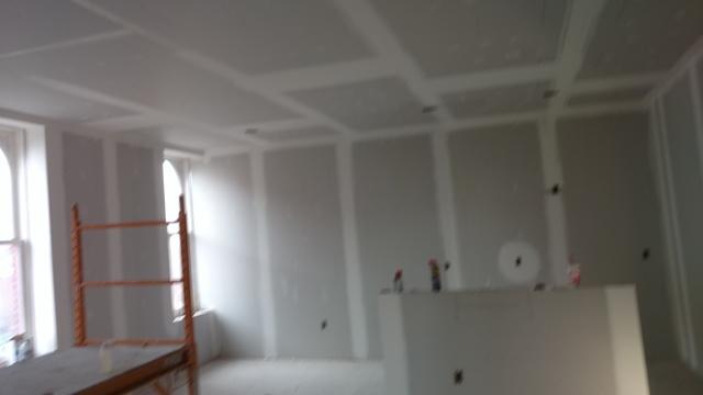 More outlets on the walls and lighting in the ceiling ready to be finished.