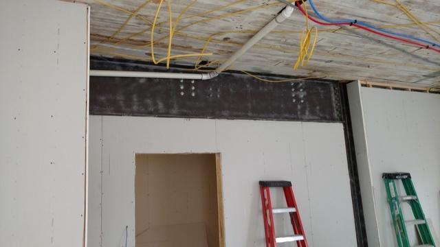 Additional electric on walls and ceilings for each new apartment being installed