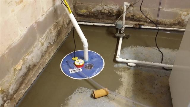 The installation of a SuperSump pump makes sure that the water collected by WaterGuard is pumped out of the basement and away from the home through a discharge line.