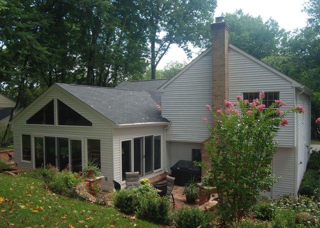 The addition, complete with sunroom and patio. Making the most of the backyard space.