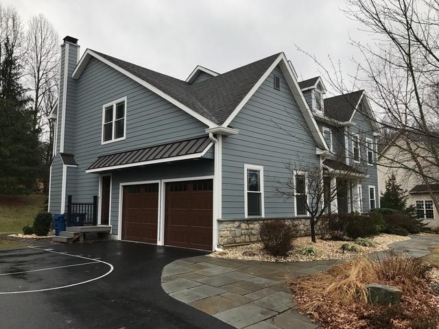 Another beautiful view complete with James Hardie Siding and a Metal Roof overhang is the envy of this Doylestown Neighborhood