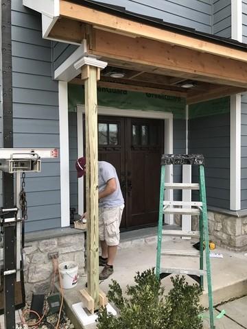 The front entrance and columns are being completely redone including a new standing seam metal roof