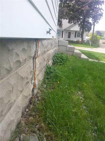 Cracked Foundation Wall Has Dangerous External Shift