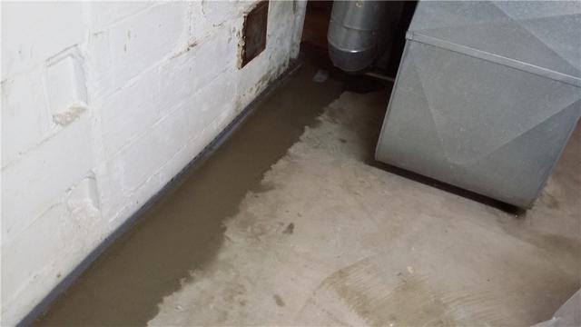 This basement should have none of its usual water seepage issues now that a proper system for collection and removal of that water is in place.