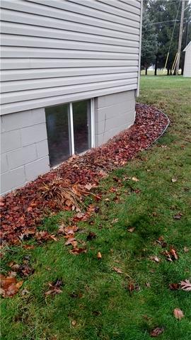 These basement windows were a decent size, but larger egress windows could let in more light and create more visual interest on the exterior of the home.