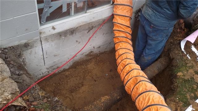 To install the egress rings, only about 2 feet of soil needed to be excavated around the window. Once completed, the block walls were cut to the necessary size for the new larger windows.