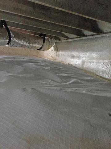 A vapor barrier is installed to seal the earth from the crawl space, this keeps moisture in the dirt below from entering the space.