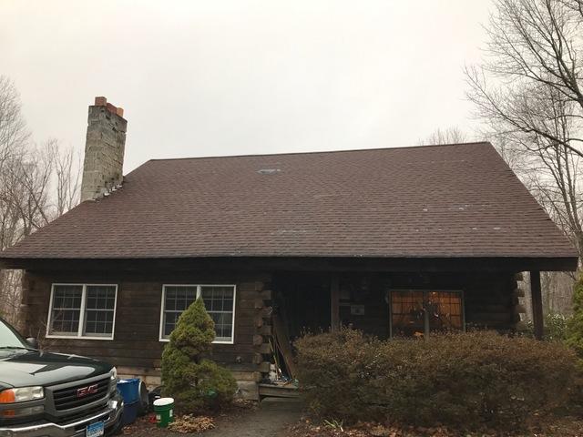 This old roof has experienced blow out from recent wind storms.