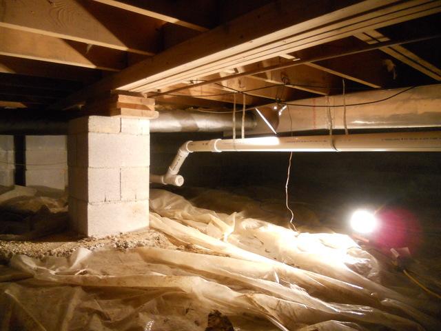 Cleanspace is being installed in this crawlspace.  Cleanspace is a water and vapor barrier, but also keep out dirt and critters.  It also helps provide insulation in cold, damp and leaky crawlspaces. 