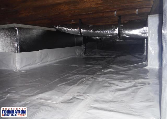 Our 10 mil CleanSpace Liner and SilverGlo complete this crawl space for a nice sealed off crawl space.