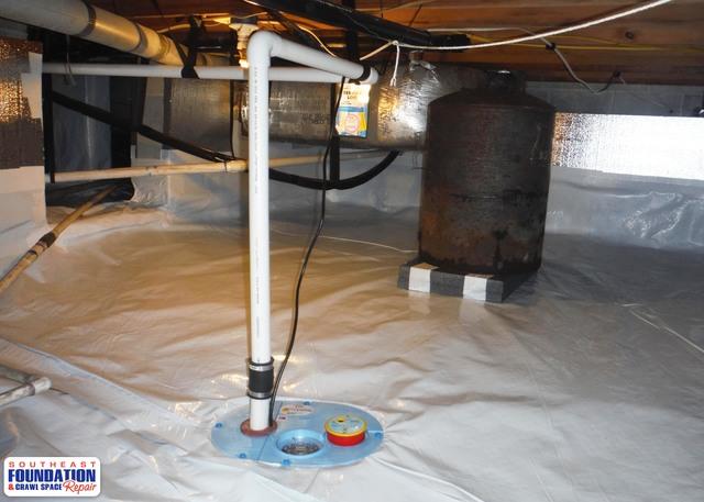 Our SmartSump sump pump installed to get rid of any water that might enter the crawl space.