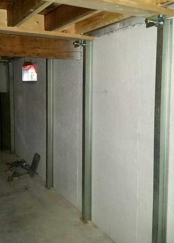 A view of a portion of the basement foundation wall where four PowerBrace™ system beams have been installed.