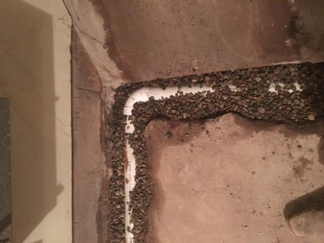 The buildings required a proper drain tile to prevent water from gathering in the basement.