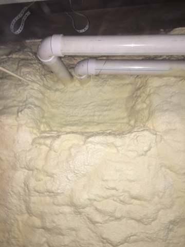 Spray Foam Insulation on a stone wall foundation