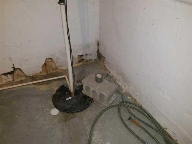 Ineffective Sump Pump in Wet Basement