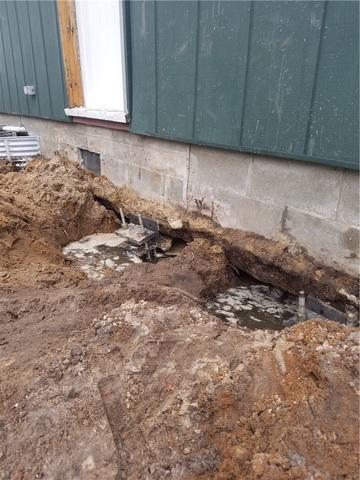 Holes Dug Along Foundation Wall