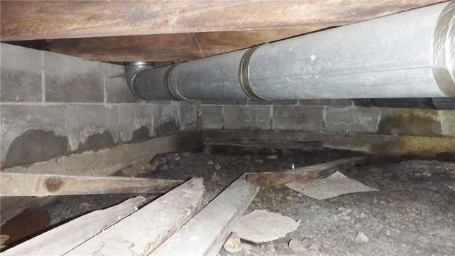 Water Damage and Debris in Crawl Space