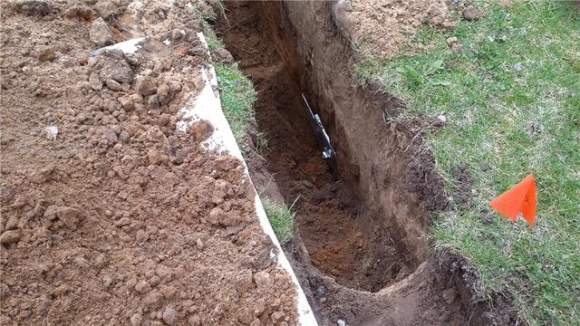 Side View of Wall Anchor Secured in Ground