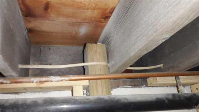 Wooden Beams Show Degree of Bowing Wall