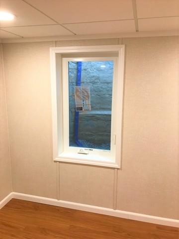 Although it's NOW required anyway, we believe every basement should have an emergency escape window!