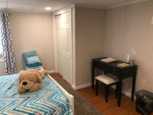 Our clients needed ample storage space and a HUGE closet if they were to have a basement - bedroom. They dreamed it, we DESIGNED it!