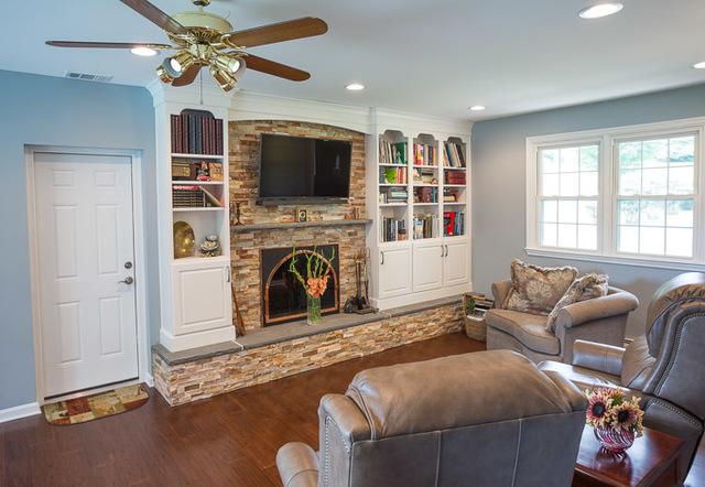 Built ins flank either side of the fireplace. With a television mounted directly over top of the fireplace the whole wall is a focal point of the room.