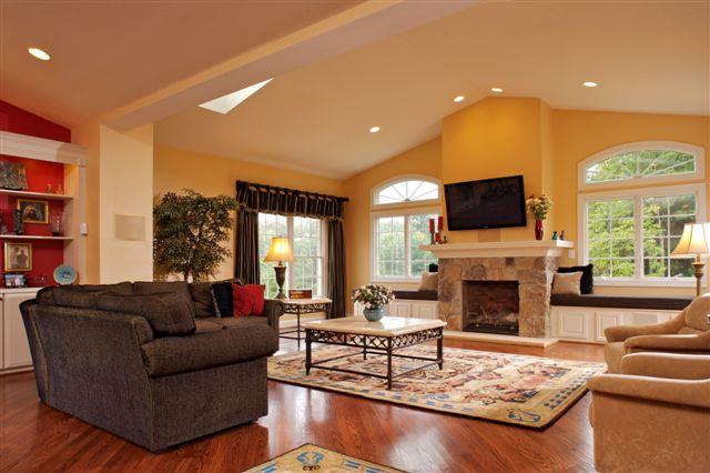 This large living space is accented by the addition of the new stone fireplace with a large screen television mounted over head.