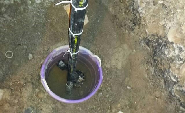 An open sump pump pit is an undesirable feature in homes: but especially when it's located within a dirt floor crawl space. Dirt and debris can easily enter the pit causing the pump to clog and malfunction. The open pit adds unwanted excess humidity in an already challenging environment.