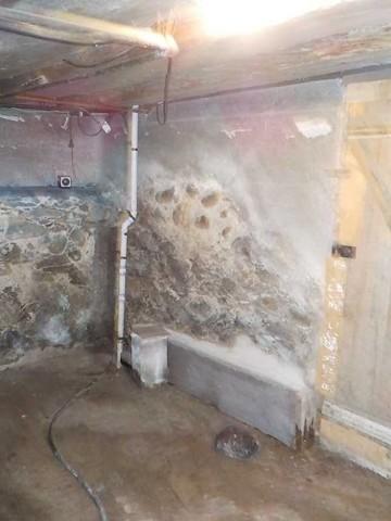 Crumbling Stone Wall in Wet Basement