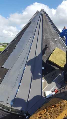 The roof is being repaired by our team of professionals.