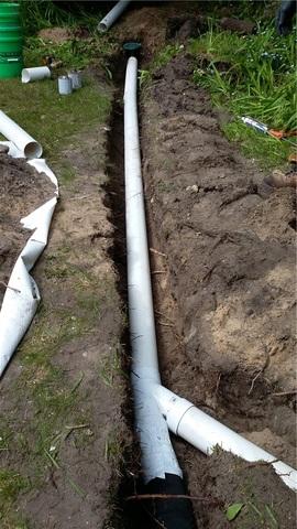 The SuperSump system in the crawl space will pump the water a safe distance away from the home through the discharge line. The LawnScape outlet at the end of the discharge line blends with the lawn and is easy to mow around.