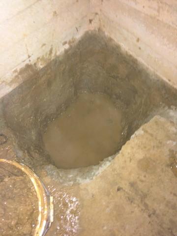 Here is a photo of where there previous failed pump was, our crew removed it and dug a deeper hole for one of our top of line sump pumps to be installed.