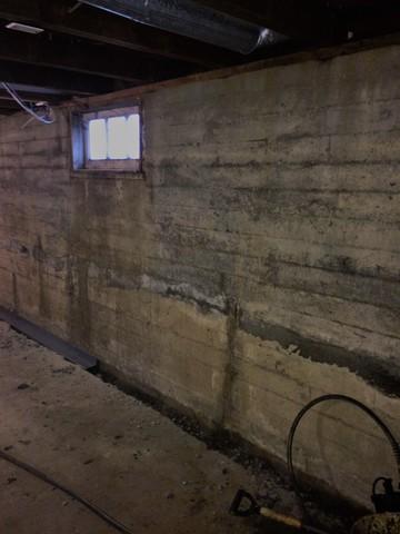 <p>Another angle of the trench with a piece of our Watergaurd in it before its fully in place. When this is finished, concrete is poured back over the trench for a nice even finish!</p>