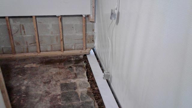 Once the crew installed the waterproofing system, they prepared the system to have concrete replaced overtop so that the homeowner can finish the floors to preference.