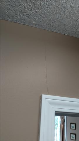 Cracks Extend Out From Doors