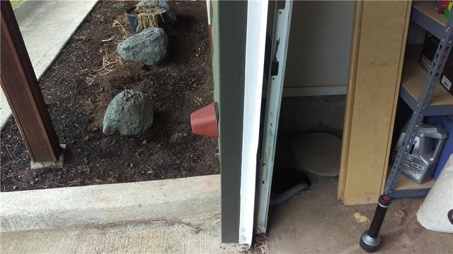 Before the crew came out to fix the pump, our inspector took a before picture of the faulty pump place behind shelves. Note: if you do not have a proper drainage system try not to store things around the area water is coming in at to decrease the risk of your things getting wet and ruined.